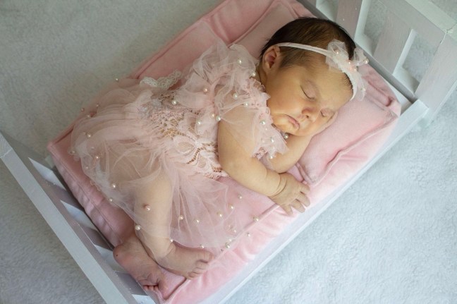 Dr. John McHugh Ga Vasectomy Reversal success sleeping baby Girl in pink pajamas